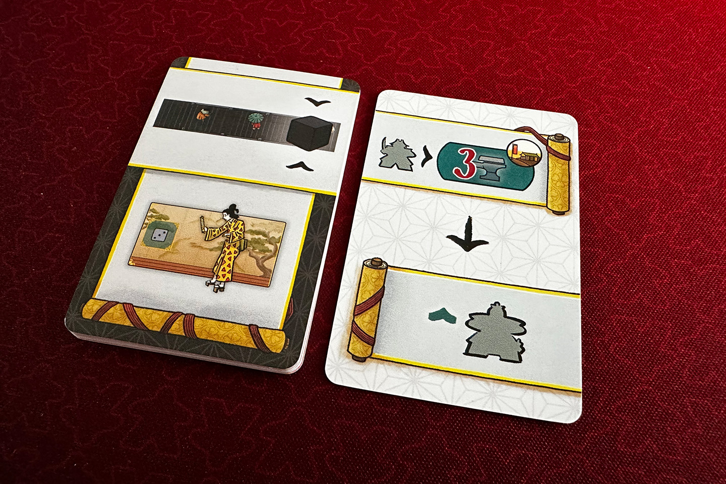 The left card tells you which die to select and where to place it. The right card tells you which actions to take. In this case, place a warrior on the training yard that requires three iron and move a courtier up one level.