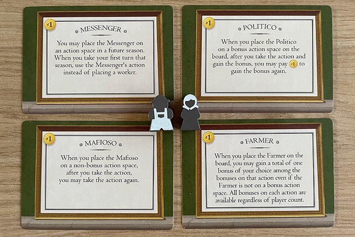 A few of the special worker cards and the neutral meeples to indicate which worker has which ablility